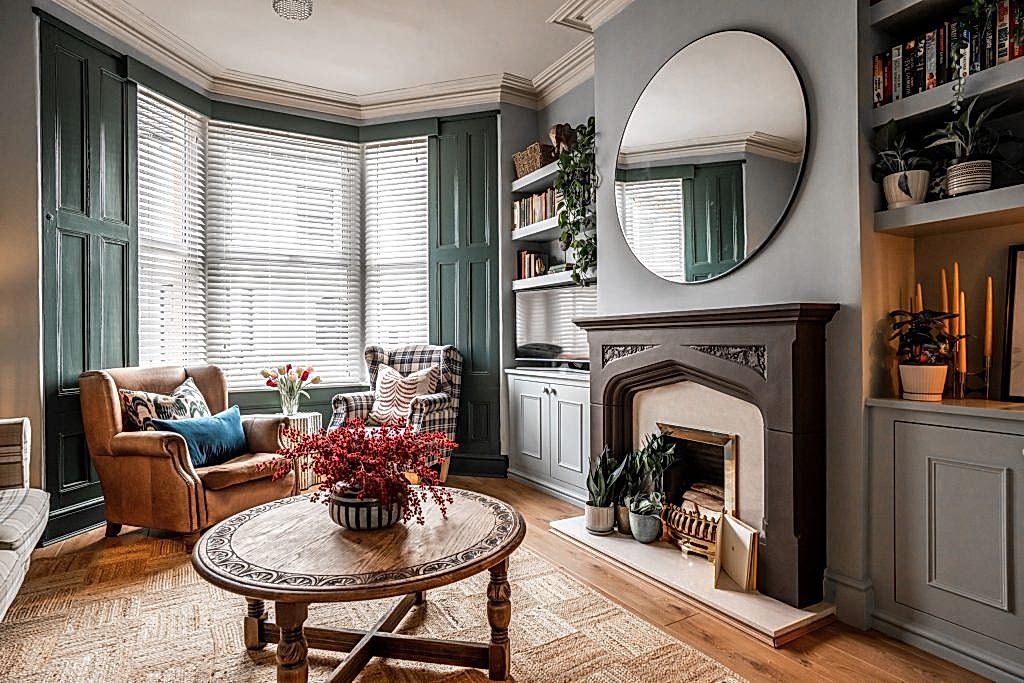 Step into this stylish living room within an Anfield, Liverpool serviced accommodation, thoughtfully designed by WildKind Interiors. The space features a cosy seating area comprising a rich...