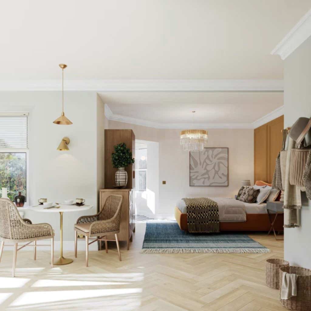 Open-plan suite pairing a dining nook with a rust velvet bed beneath a glass chandelier, framed by soft sage walls.