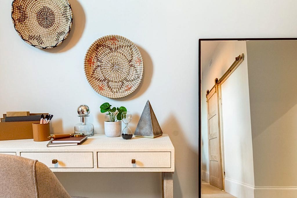 This impeccably staged home office corner in Scartho, Lincolnshire features a stylish textured desk adorned with curated decorative pieces to captivate prospective buyers. Above the desk...