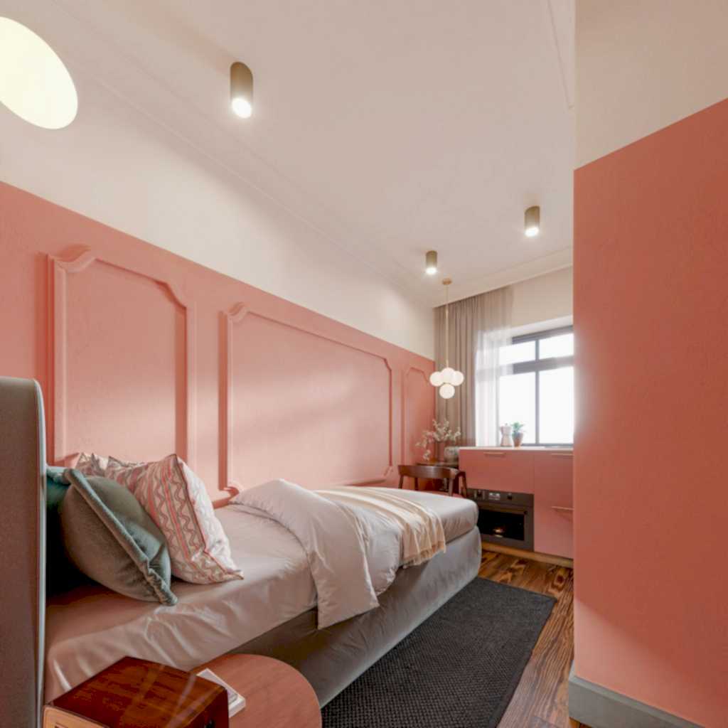 Micro studio with a coral panelled feature wall, layered bedding and a statement pendant.